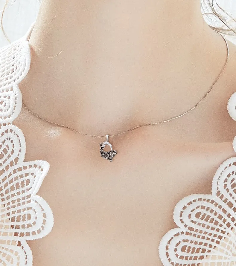 The black diamond whale necklace